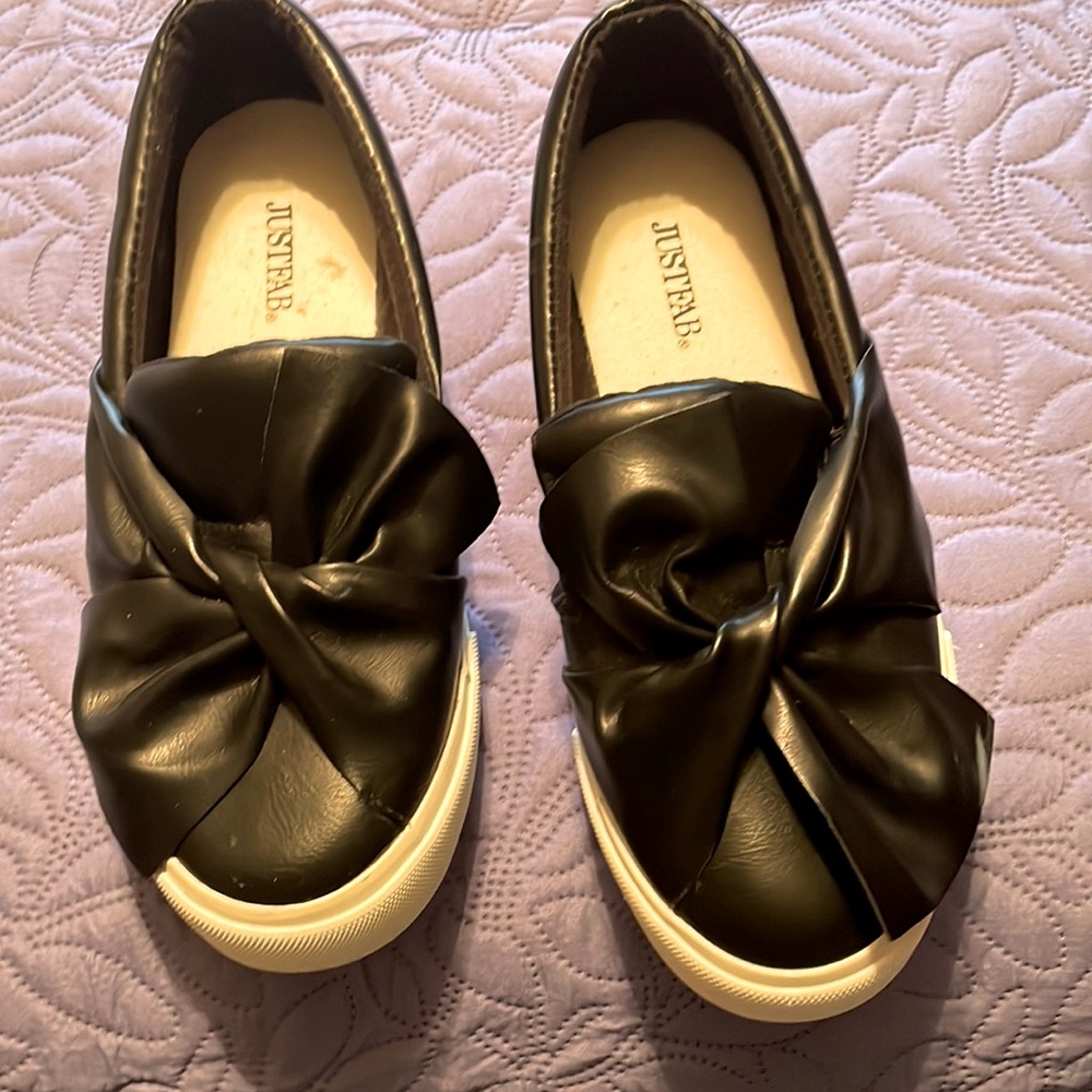 Black shoes with bows.